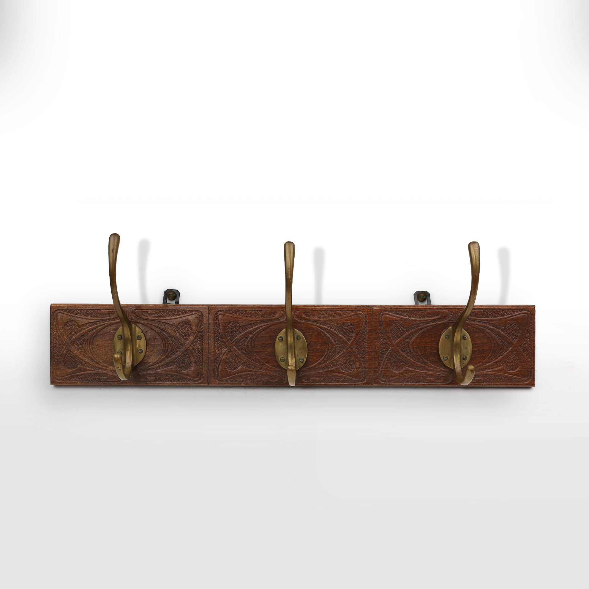 Art Nouveau wall coat rack in carved wood with brass, France ca. 1910thumbnail